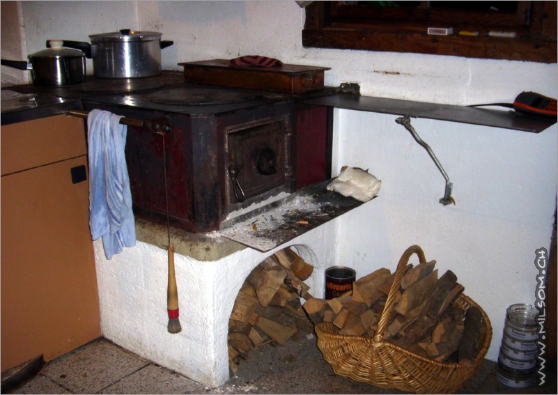 the delicious food is cooked on a wood-heated-stove